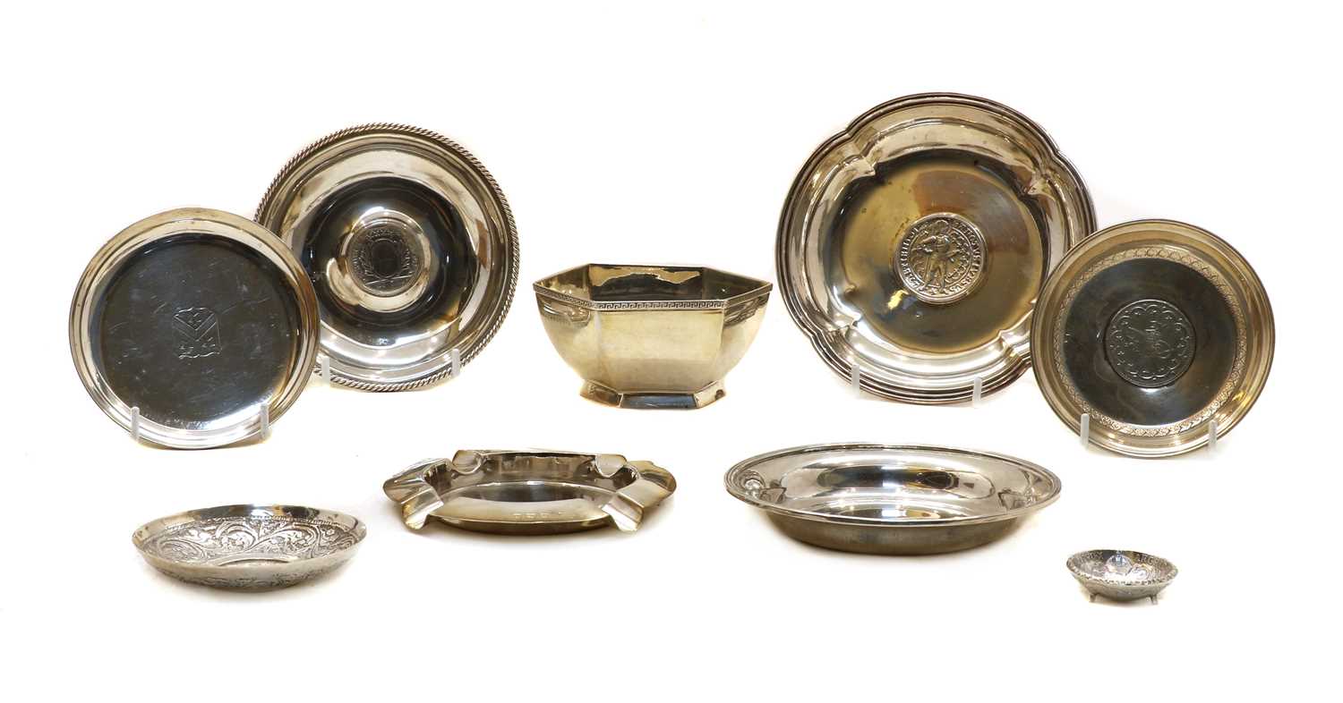 A quantity of various silver and white metal pin dishes