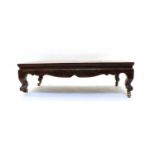 A low Chinese hardwood table,