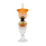 A cut-glass oil lamp, possibly Waterford,