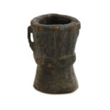 A turned and carved wooden mortar,