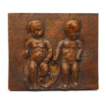A continental stained oak plaque,
