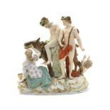 A Meissen porcelain figural group of the drunken Silenus,