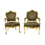 Two French Louis XV-style giltwood fauteuils,