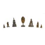 A collection of miniature Buddhist figures,