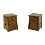 A pair of Arts and Crafts-type oak bedside cabinets