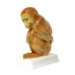 A porcelain figure of a monkey,