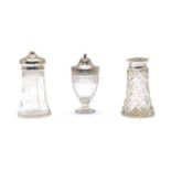 Three various glass and silver topped casters,