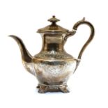 A George III silver tea pot,