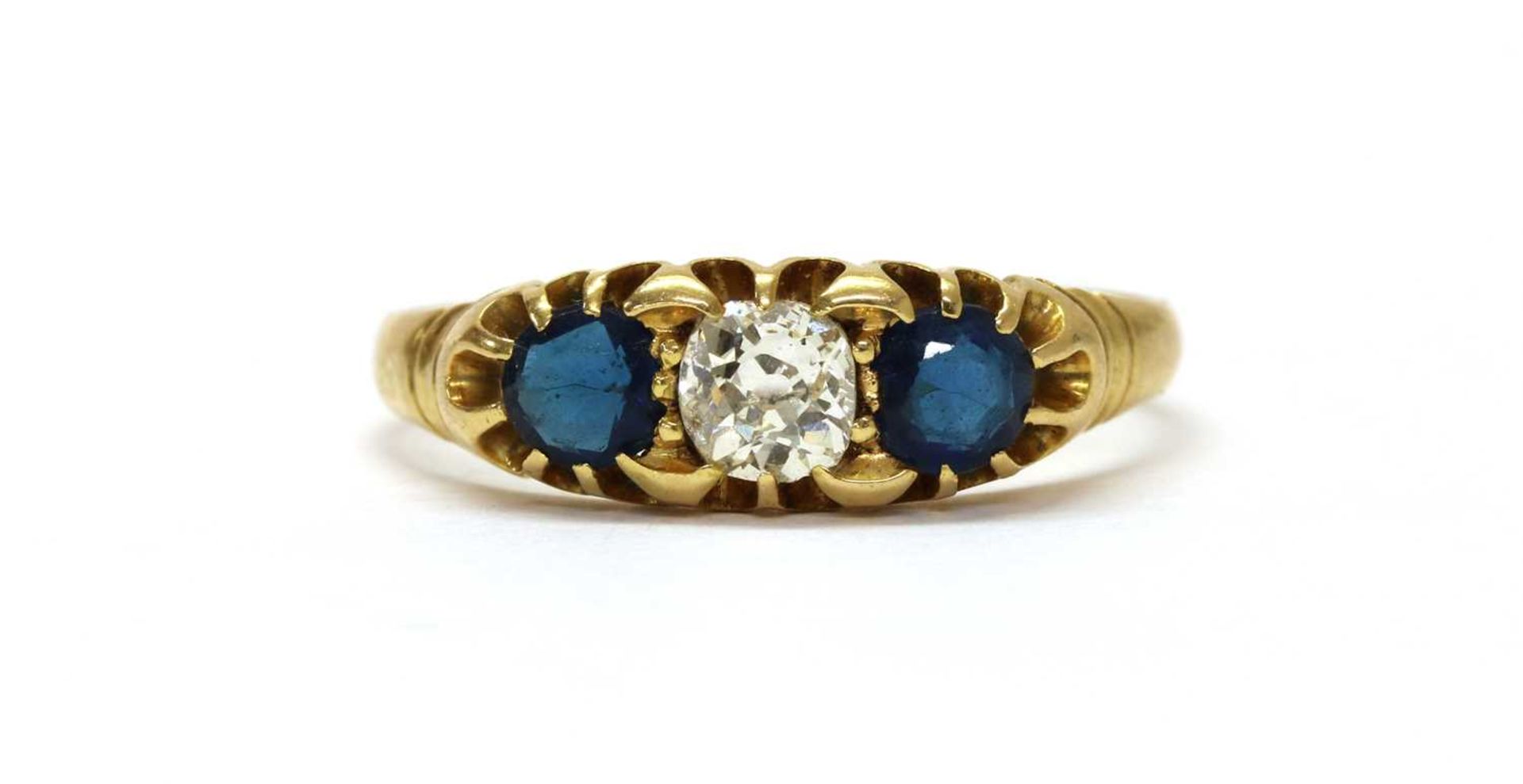 An Edwardian gold diamond and sapphire three stone ring,