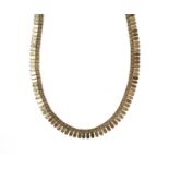 A gold fringe necklace,