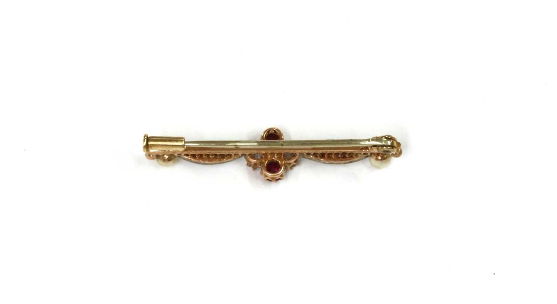 A gold and silver, ruby, diamond split pearl bar brooch, - Image 2 of 2