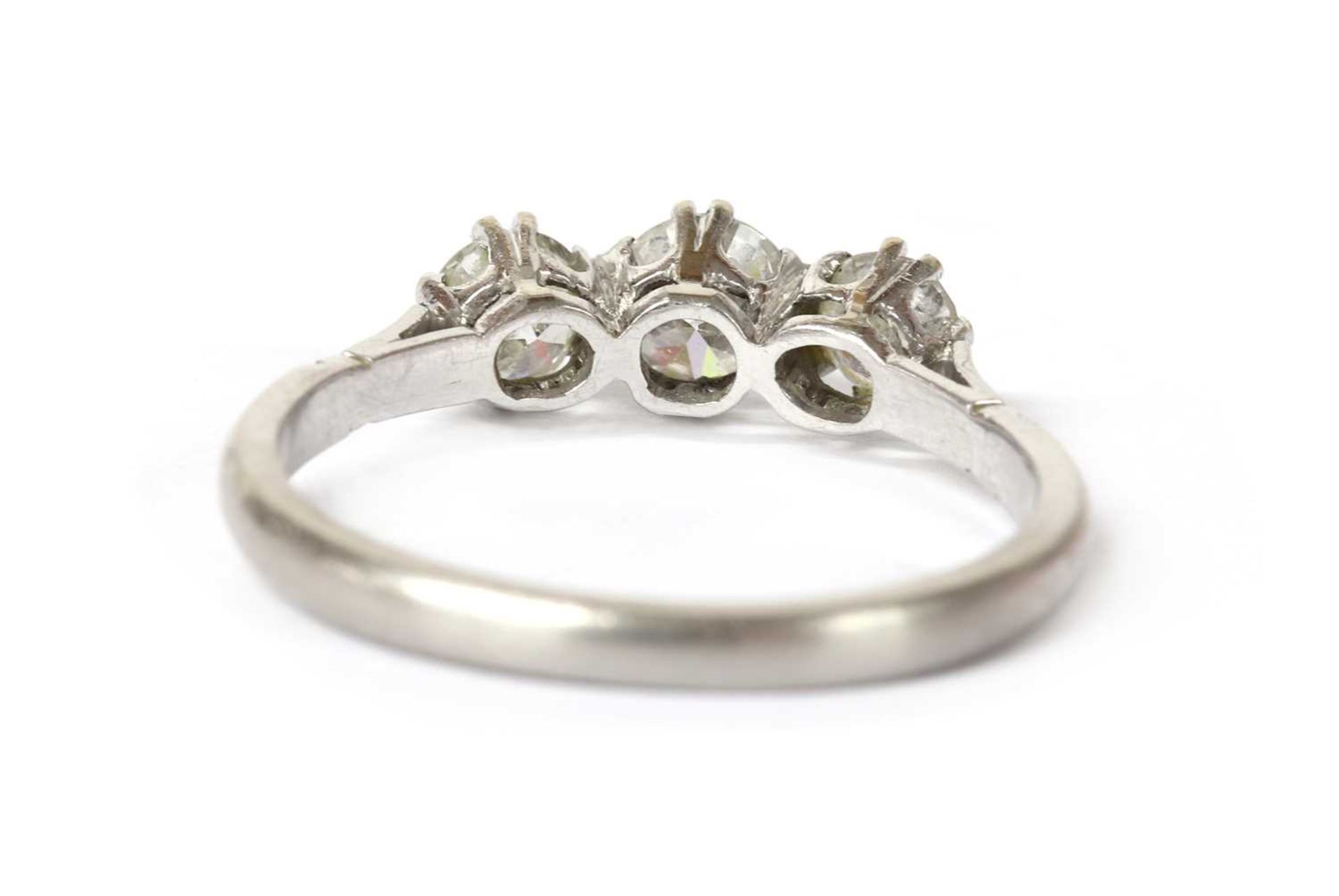 A platinum three stone diamond ring, - Image 3 of 3