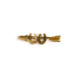 A late Victorian gold arrow and horseshoe brooch,