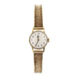 A ladies' 9ct gold Tissot mechanical bracelet watch,
