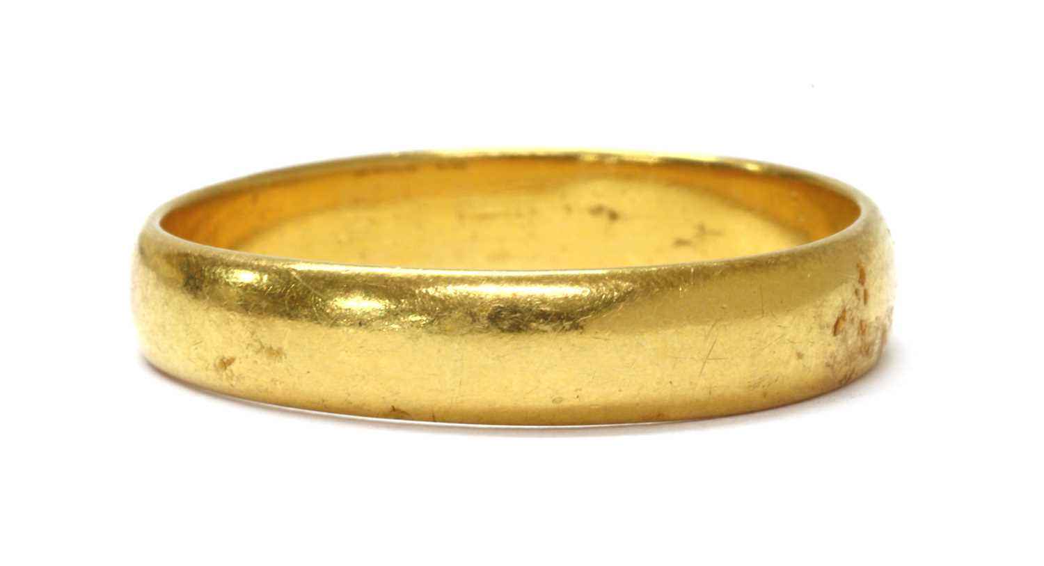 A 22ct gold 'D' section wedding ring,