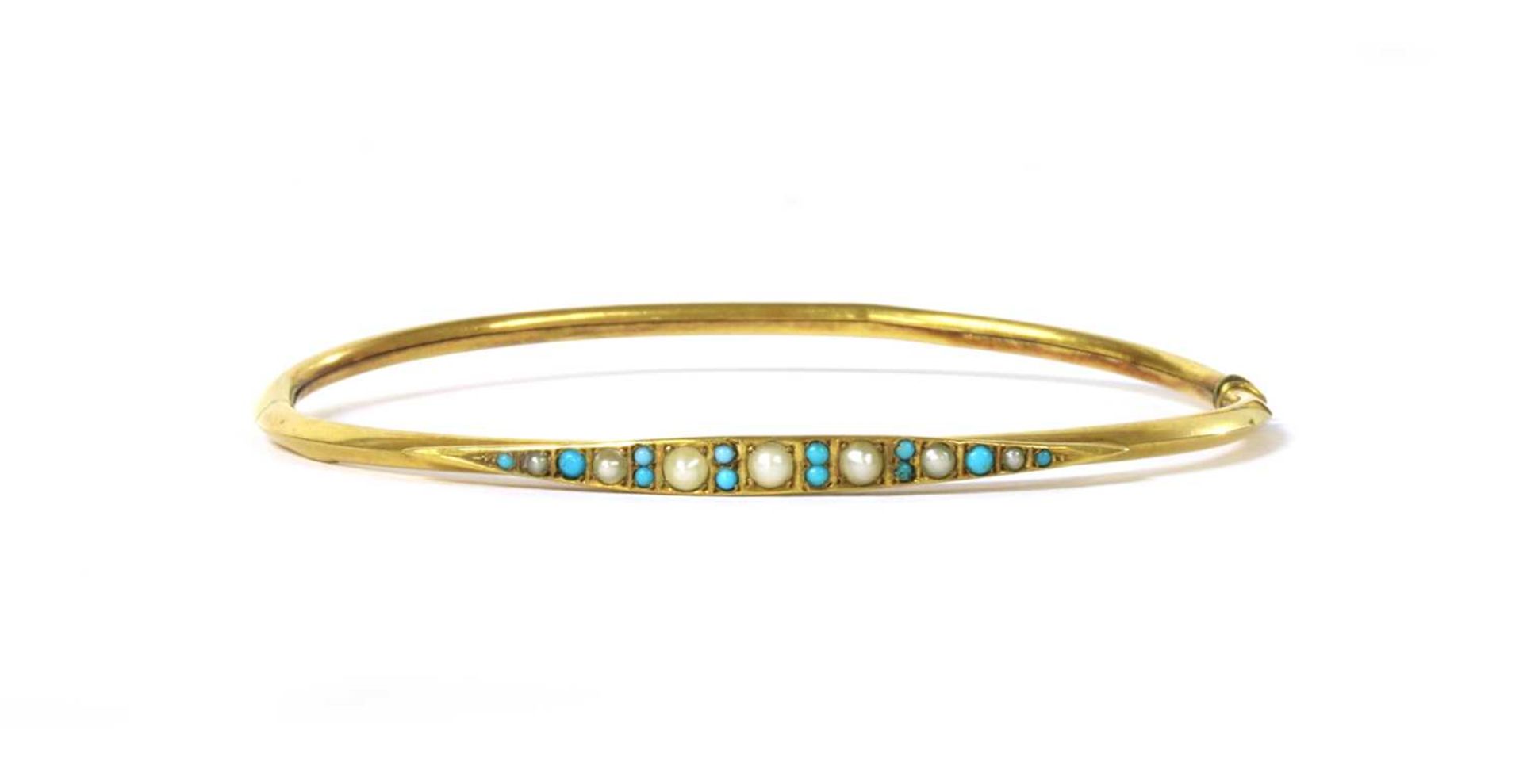 An Edwardian gold split pearl and turquoise oval bangle,