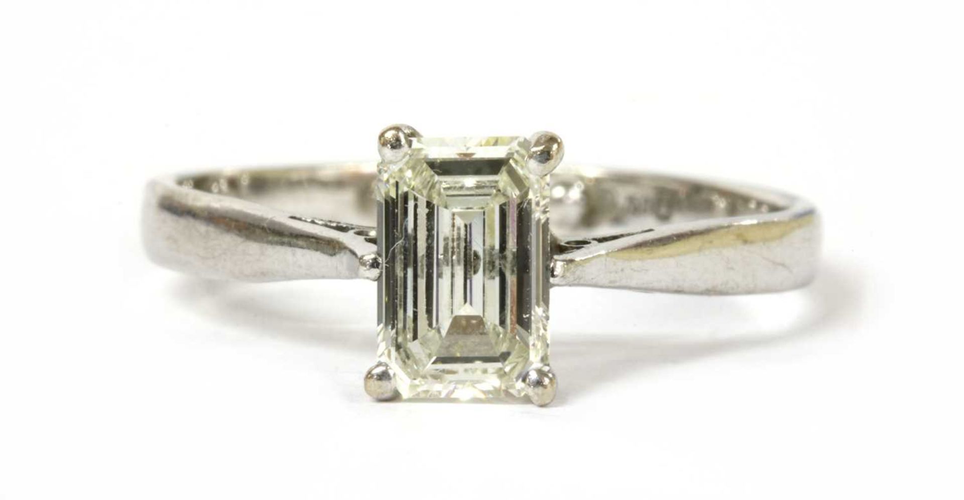 An 18ct white gold single stone emerald cut diamond ring,