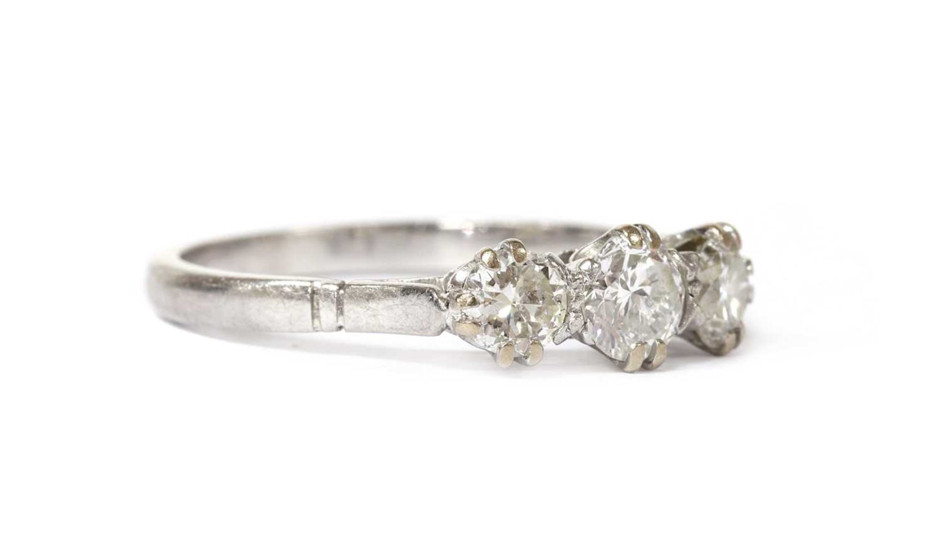 A platinum three stone diamond ring, - Image 2 of 3