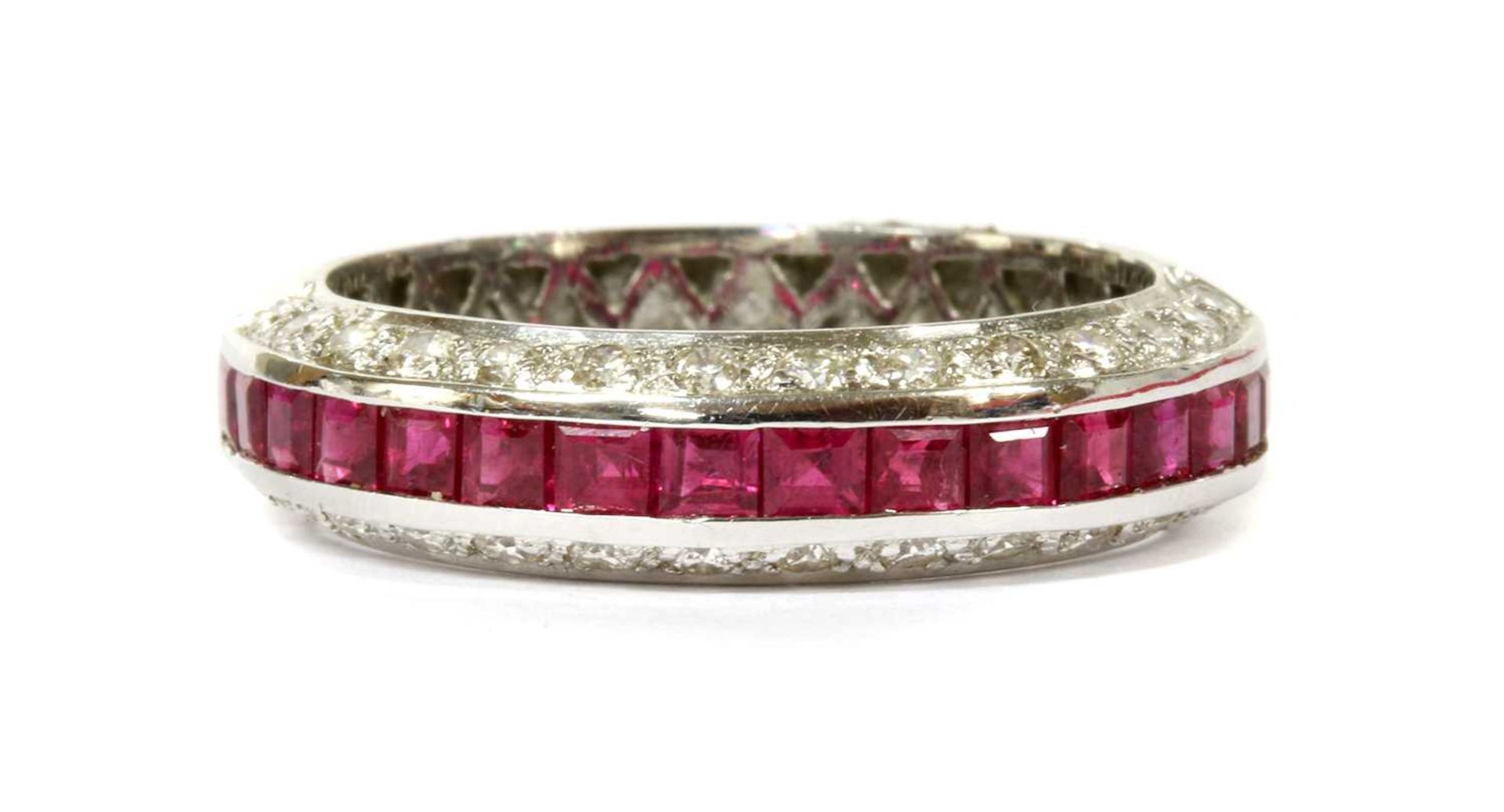 A white gold ruby and diamond half eternity ring,