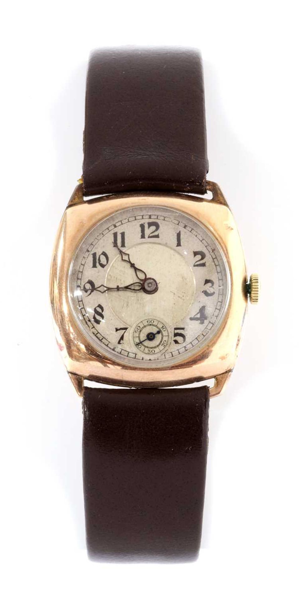 A 9ct gold cushion shaped mechanical strap watch,