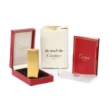 A cased Must de Cartier gold plated gas lighter,