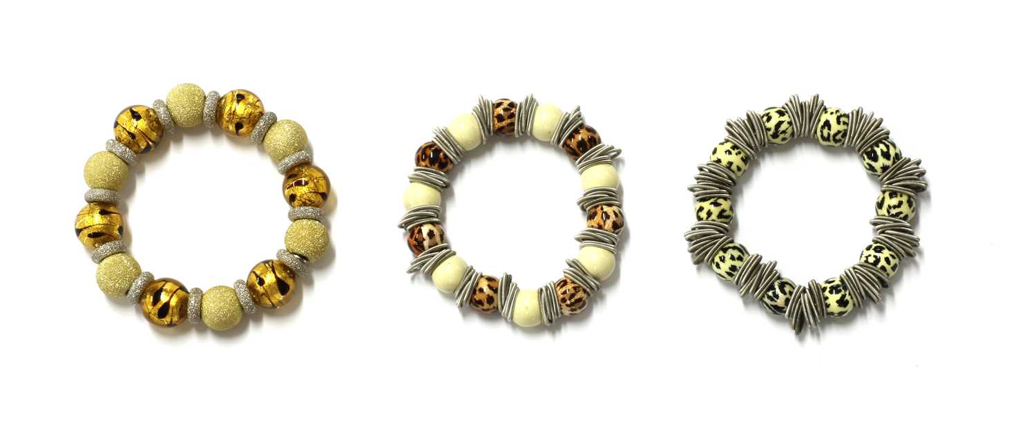 Three silver bead bracelets,