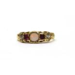 A gold opal, ruby and diamond ring,