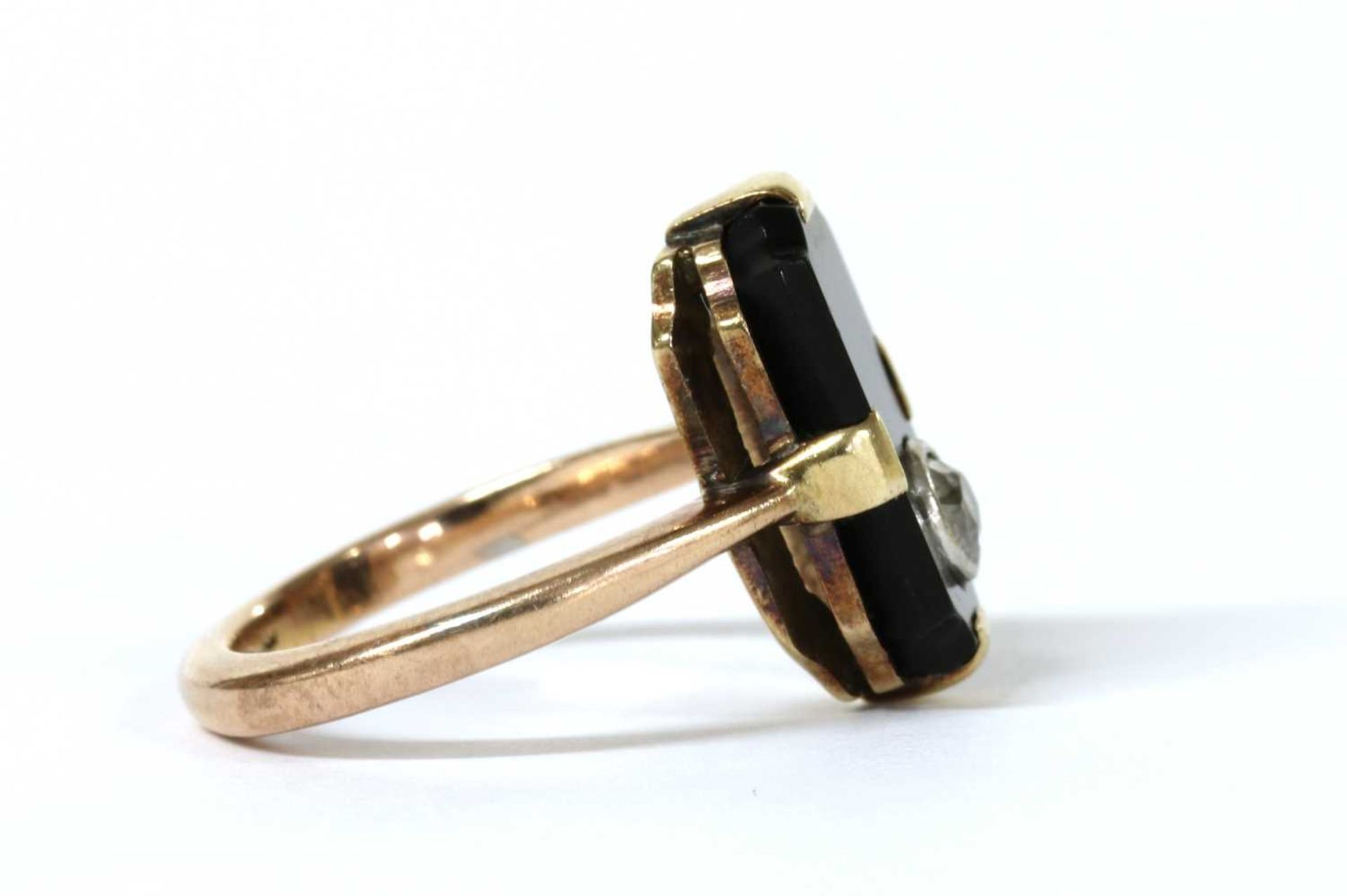 A gold diamond and onyx ring, - Image 2 of 3