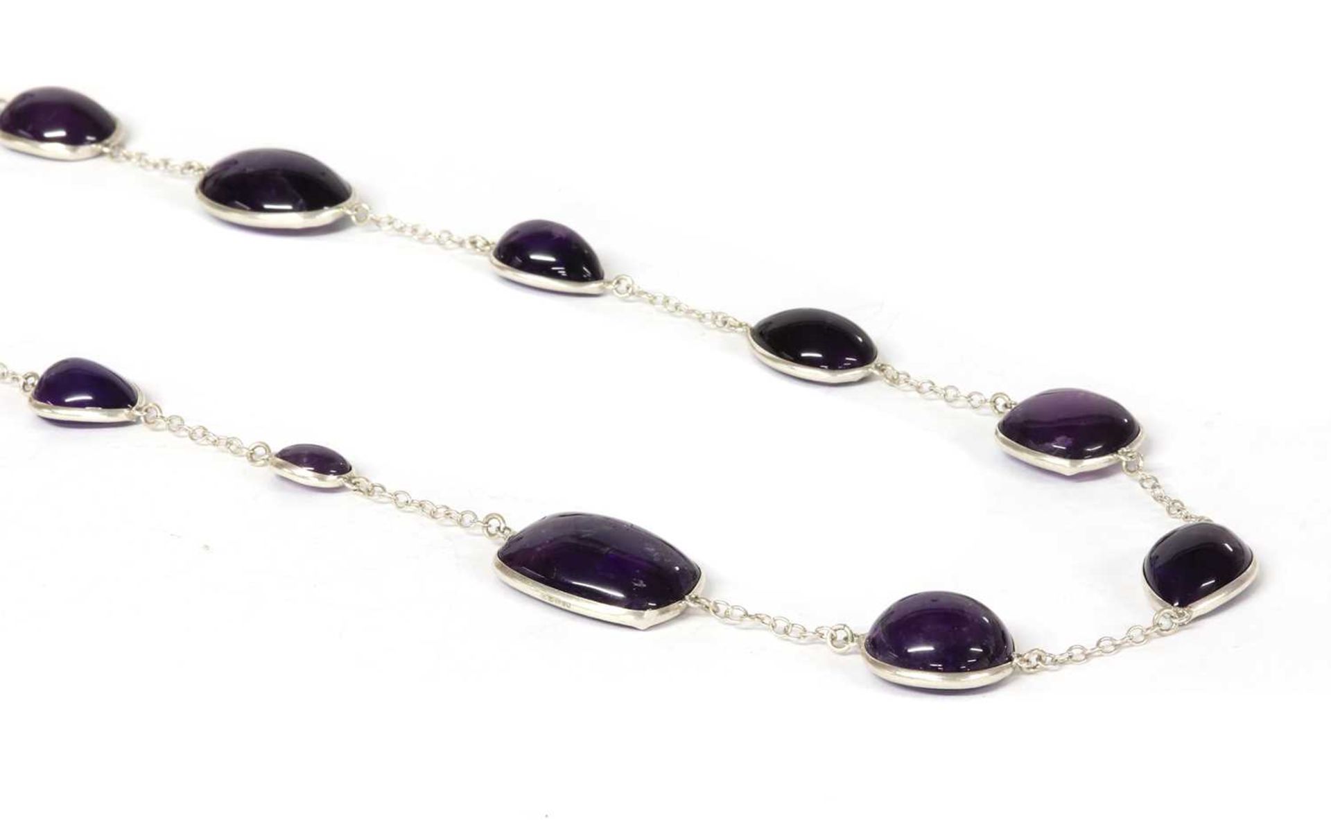 A silver amethyst long chain,