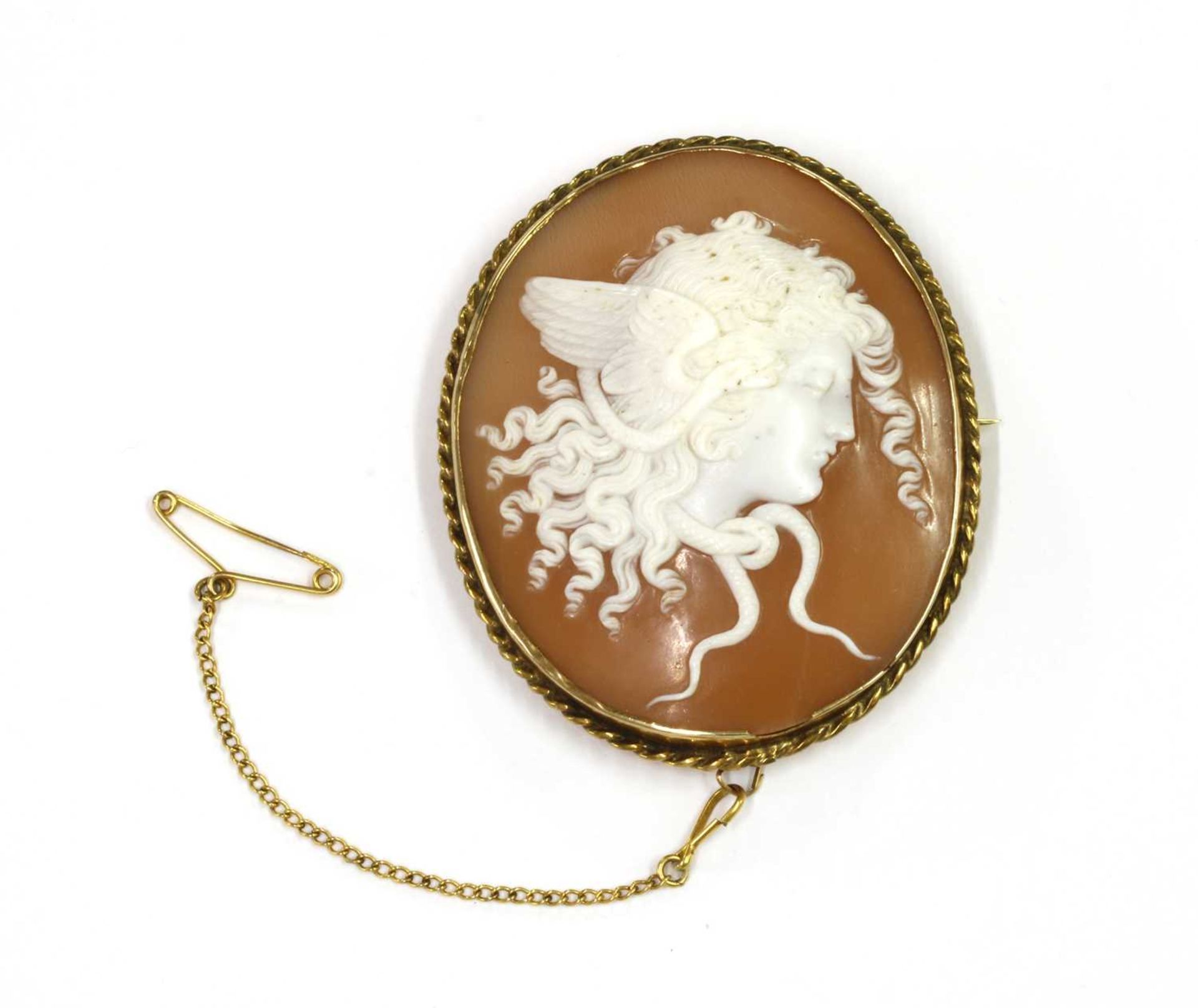 A gold mounted shell cameo brooch,