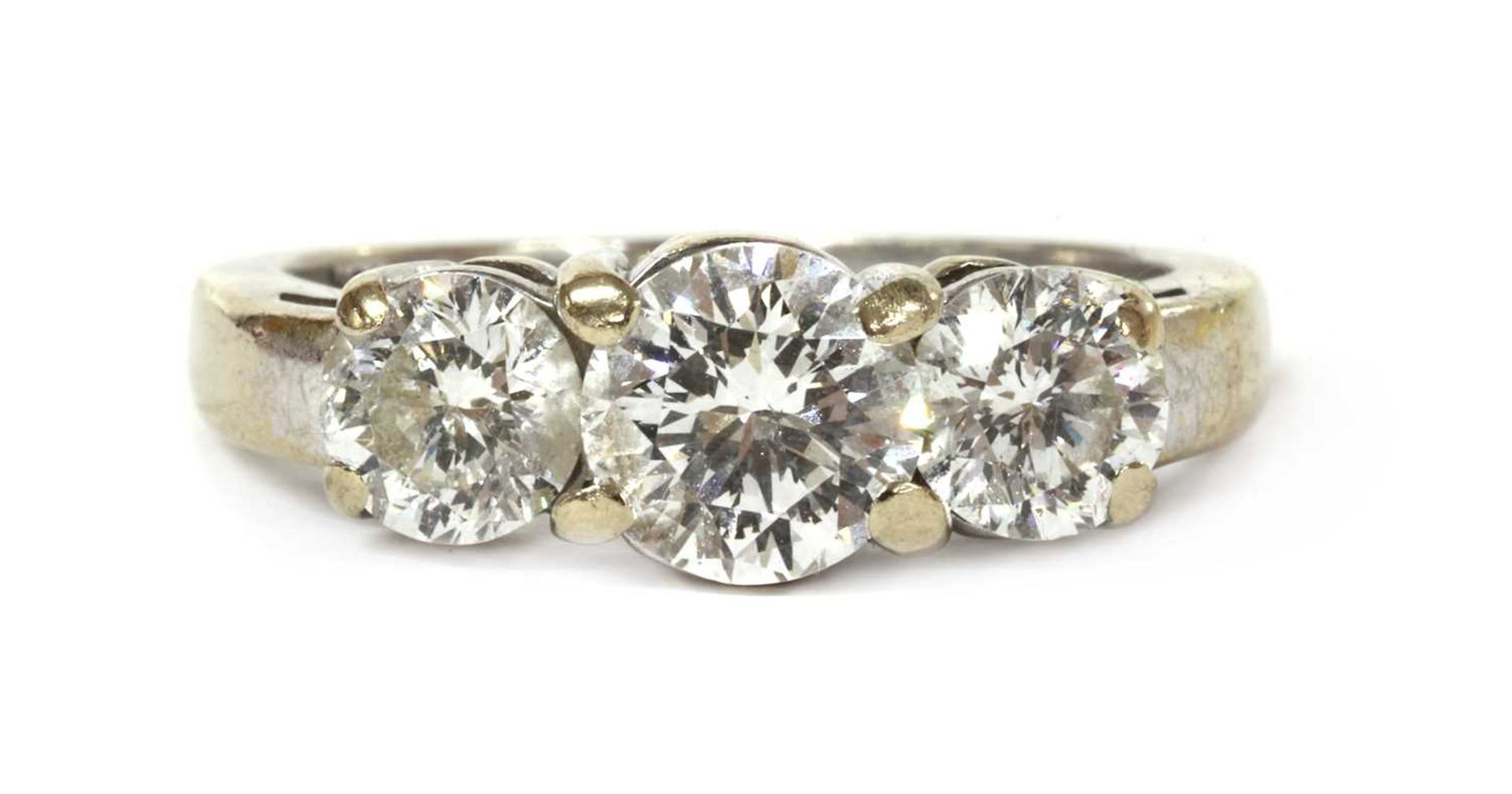 A white gold three stone diamond ring,