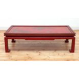 A Chinese-style red-lacquered coffee table in the manner of Mallett & Sons,