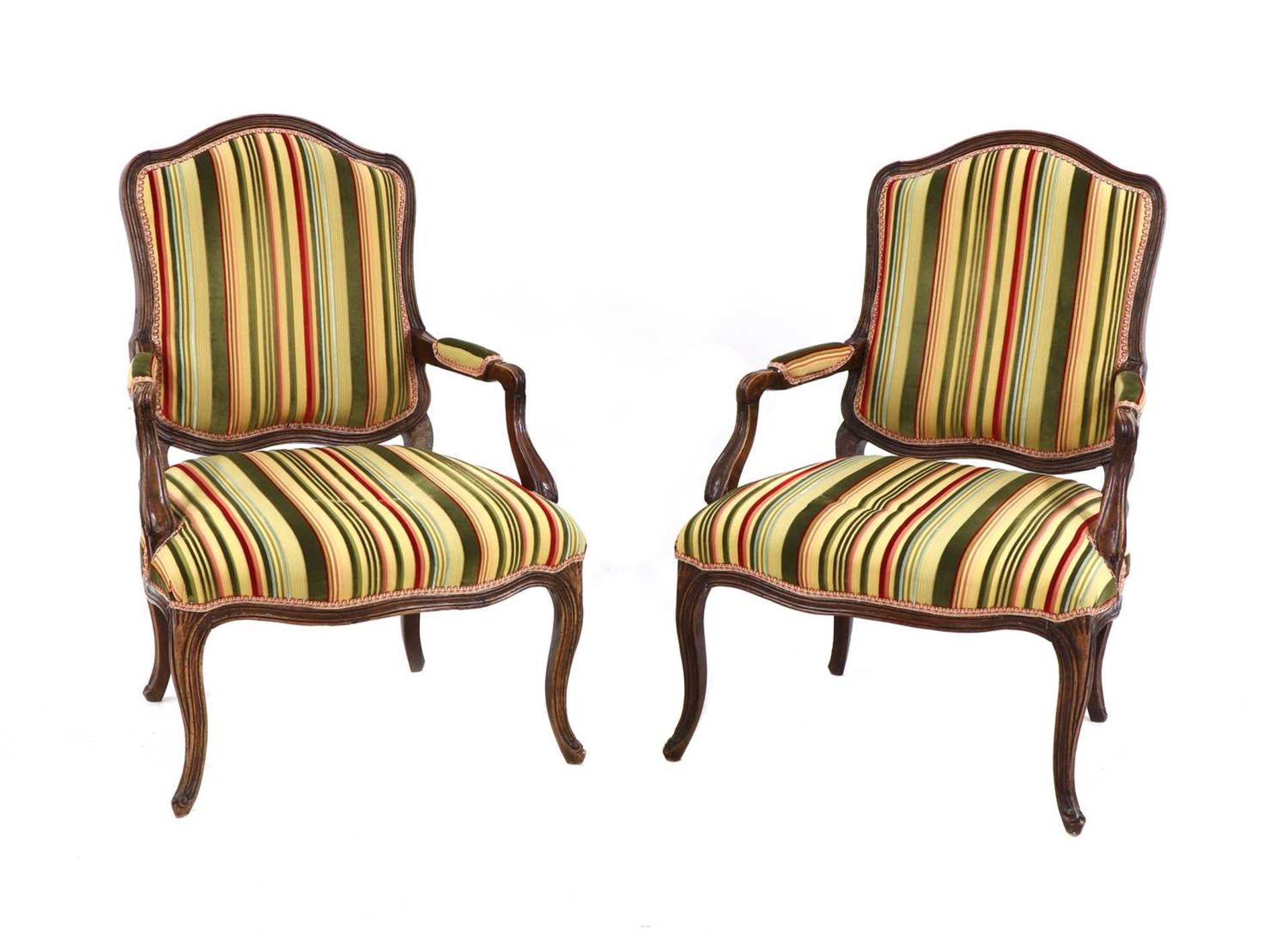 A pair of French Louis XV beech fauteuils,