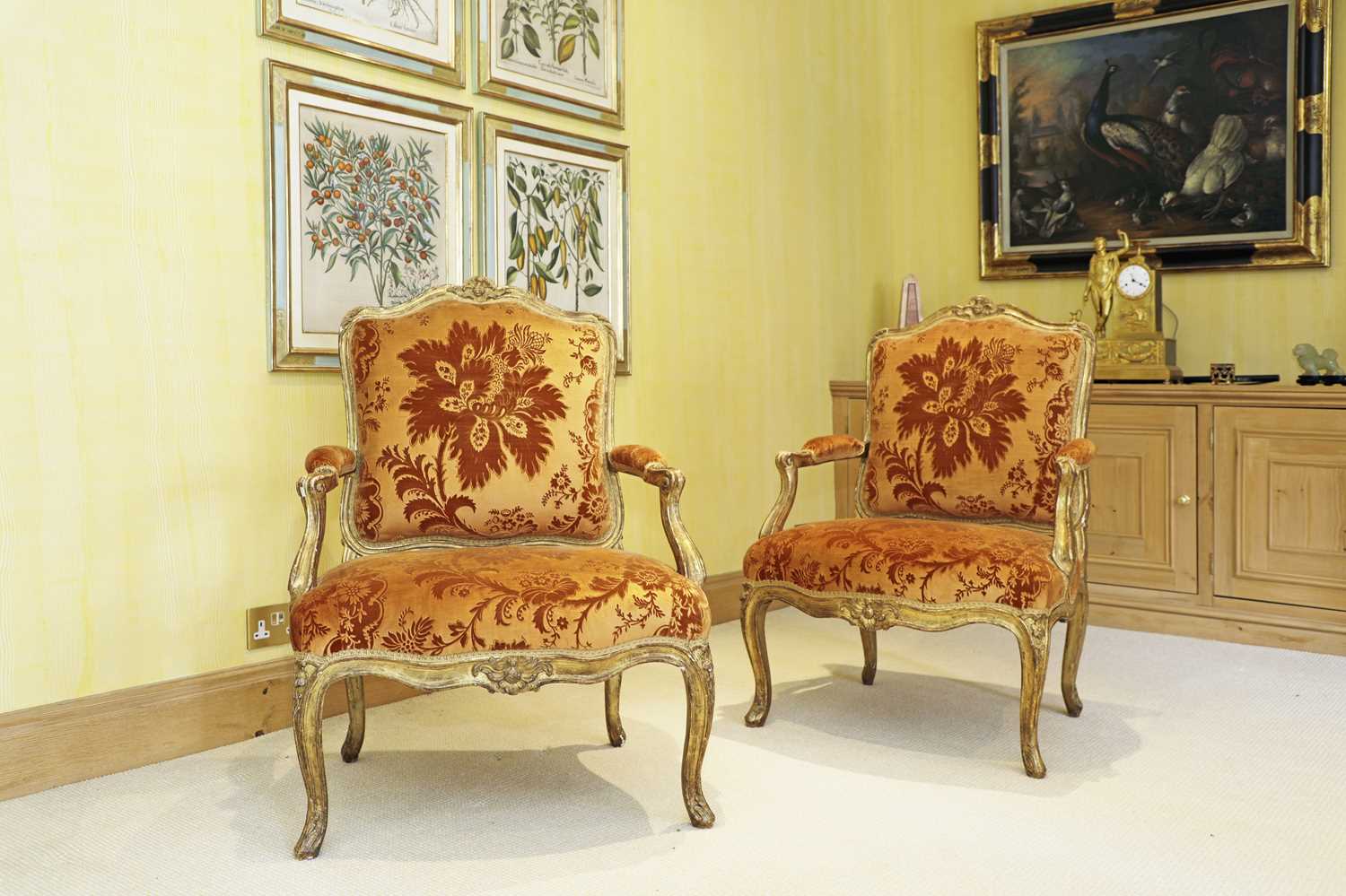 A pair of French Louis XV giltwood fauteuils à la reine,