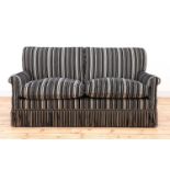 A modern two-seater sofa by Howard Chairs Ltd.