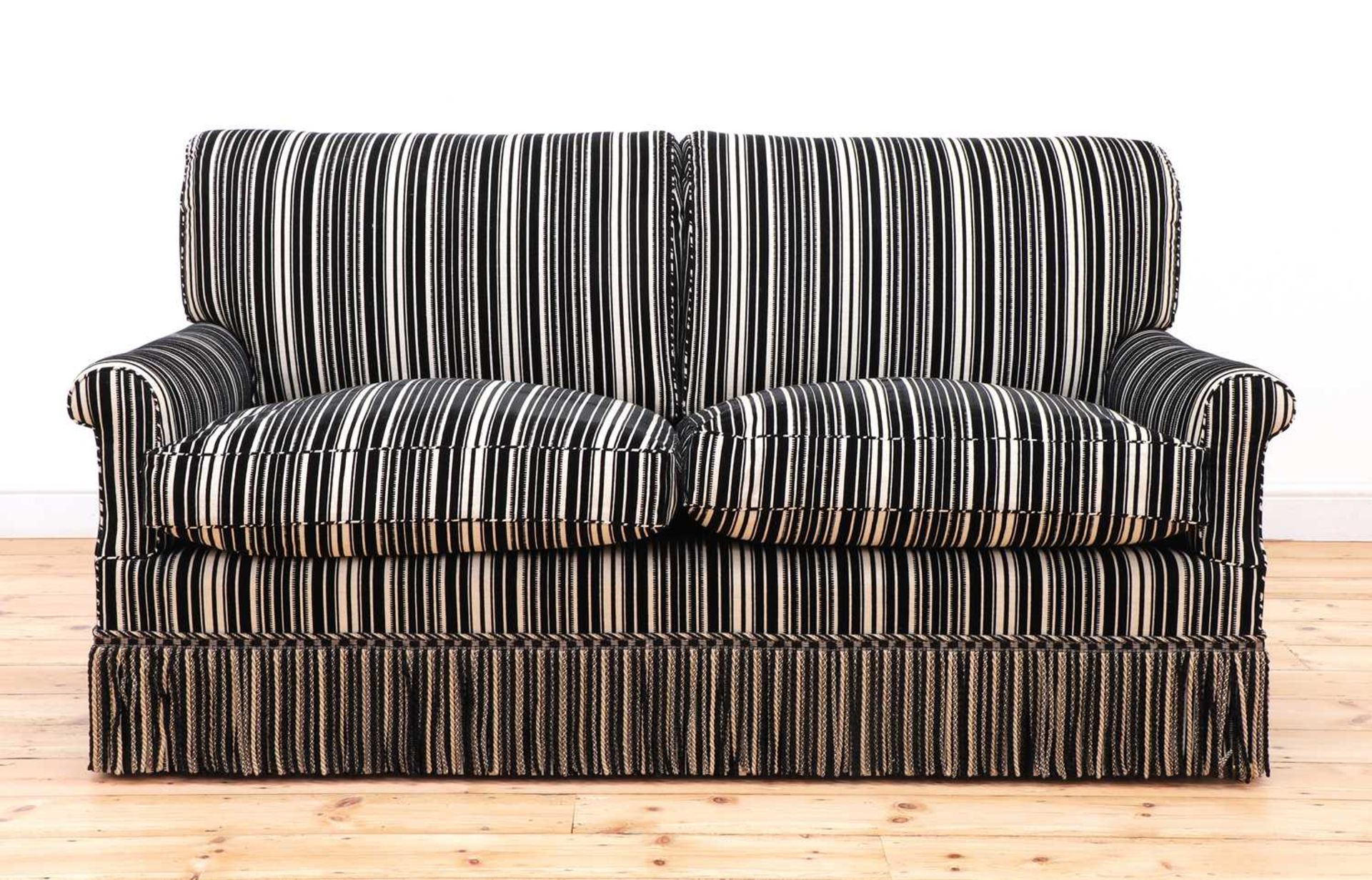 A modern two-seater sofa by Howard Chairs Ltd.