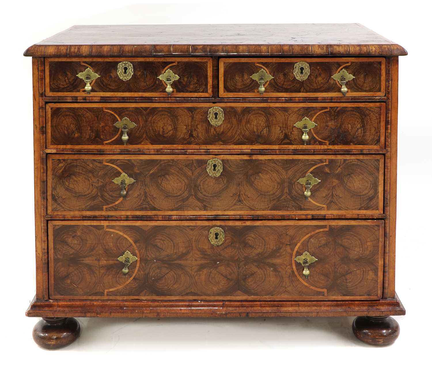 A William and Mary oyster veneered laburnum and fruitwood inlaid chest of drawers