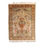 A silk Qum rug,