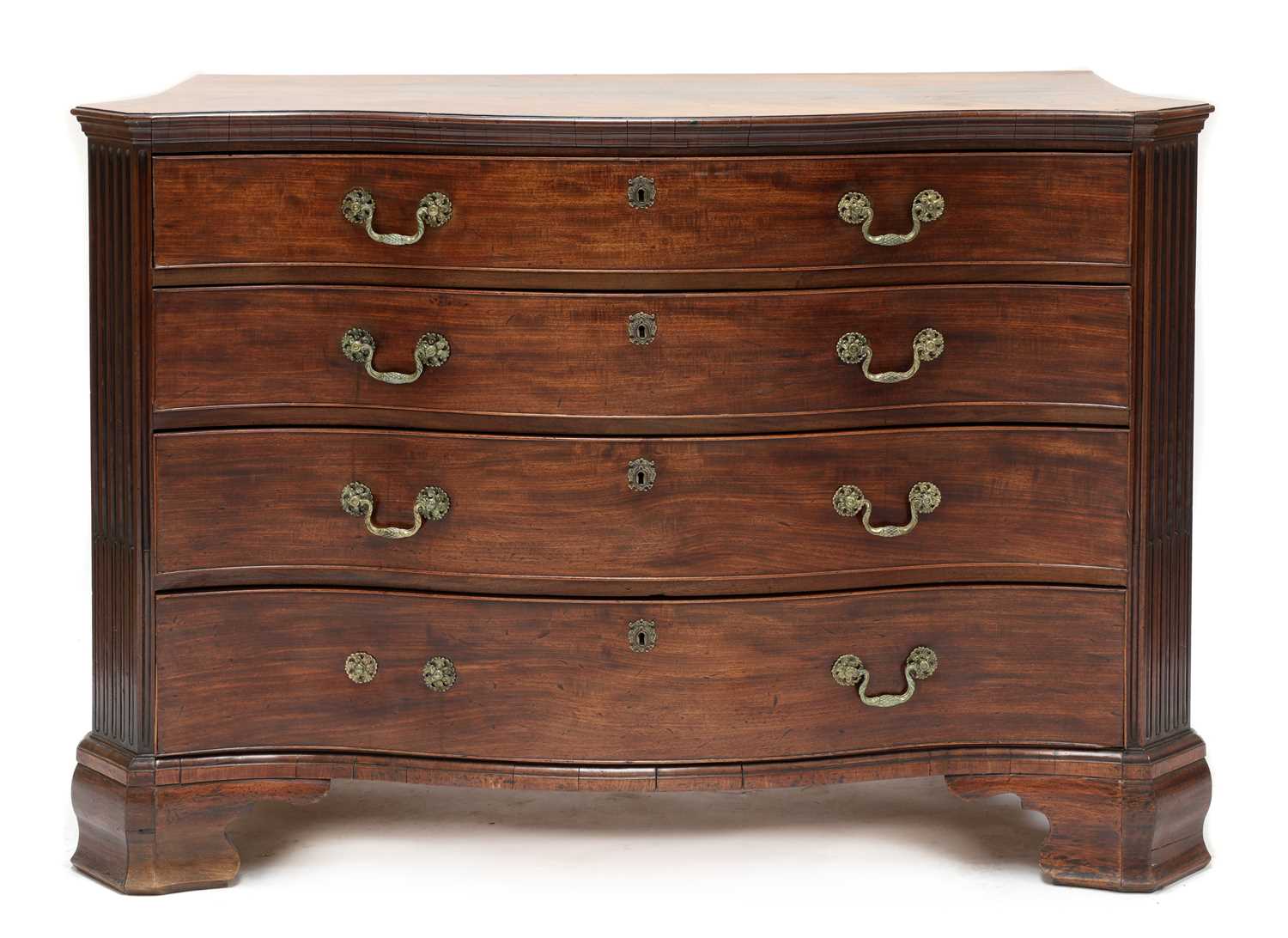 A George III mahogany serpentine commode,