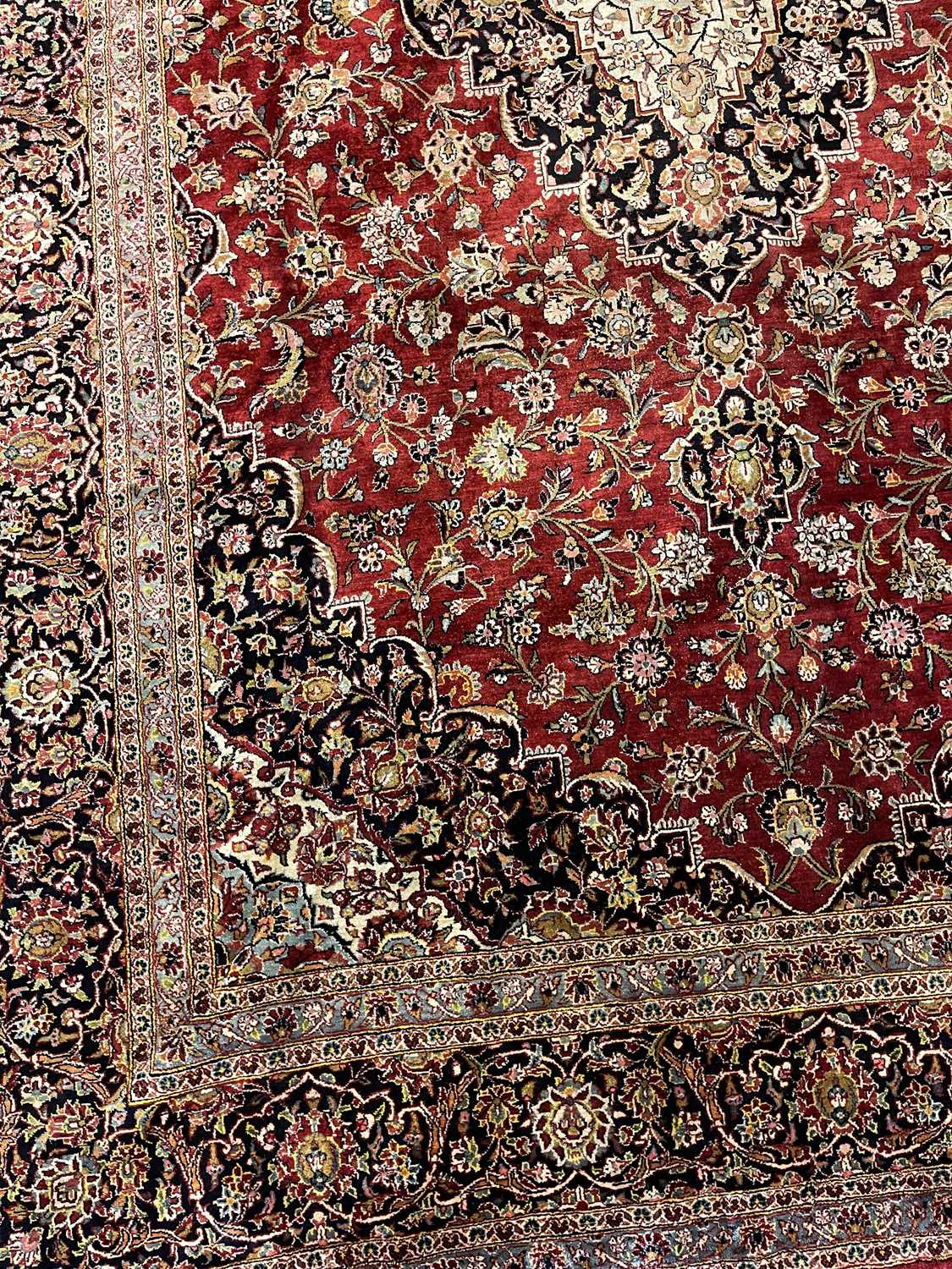 A Persian wool and silk Kashan carpet, - Image 15 of 15