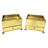 A pair of large brass ashtrays,