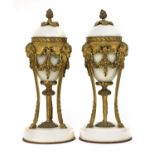 A pair of French Empire-style white marble and ormolu cassolettes,