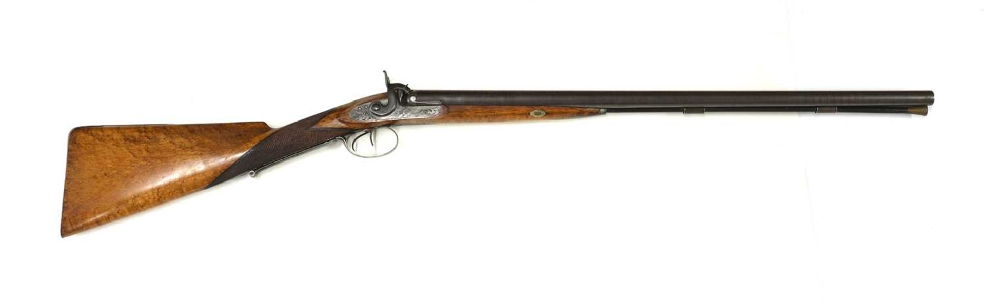 A 12-bore double-barrelled percussion shotgun,