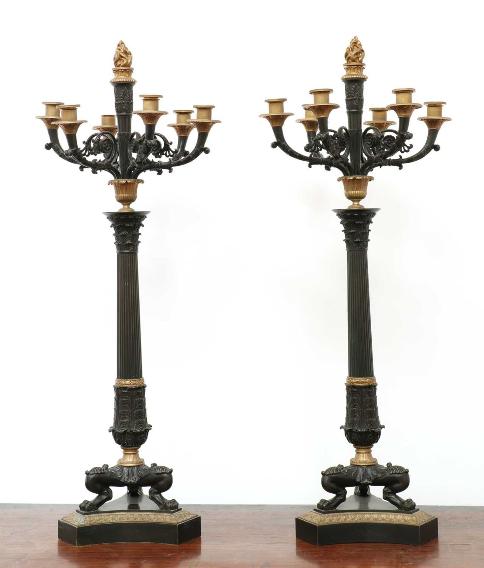 A pair of large gilt and patinated bronze seven-light candelabra,