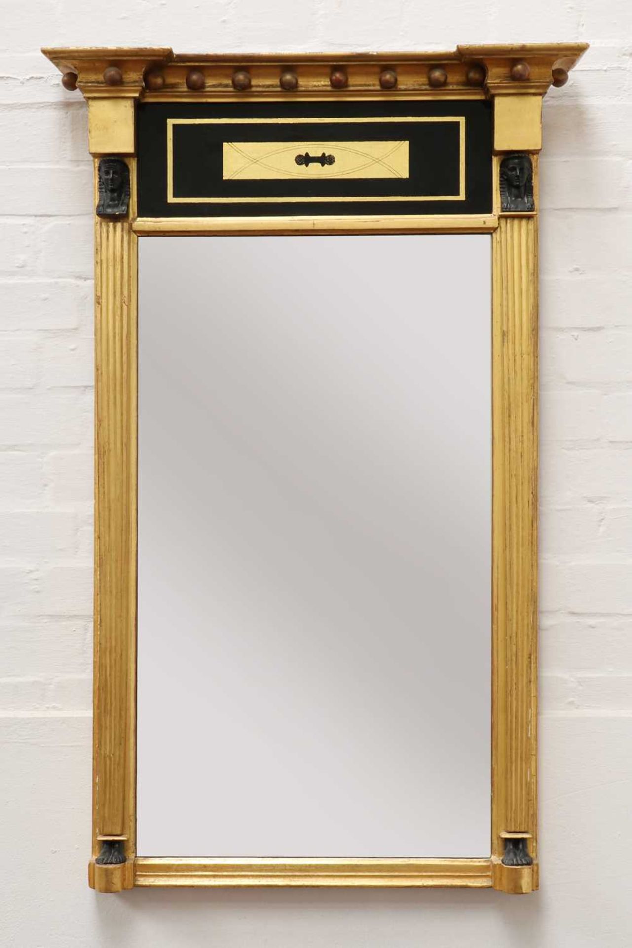 A Regency Egyptian Revival giltwood pier mirror,