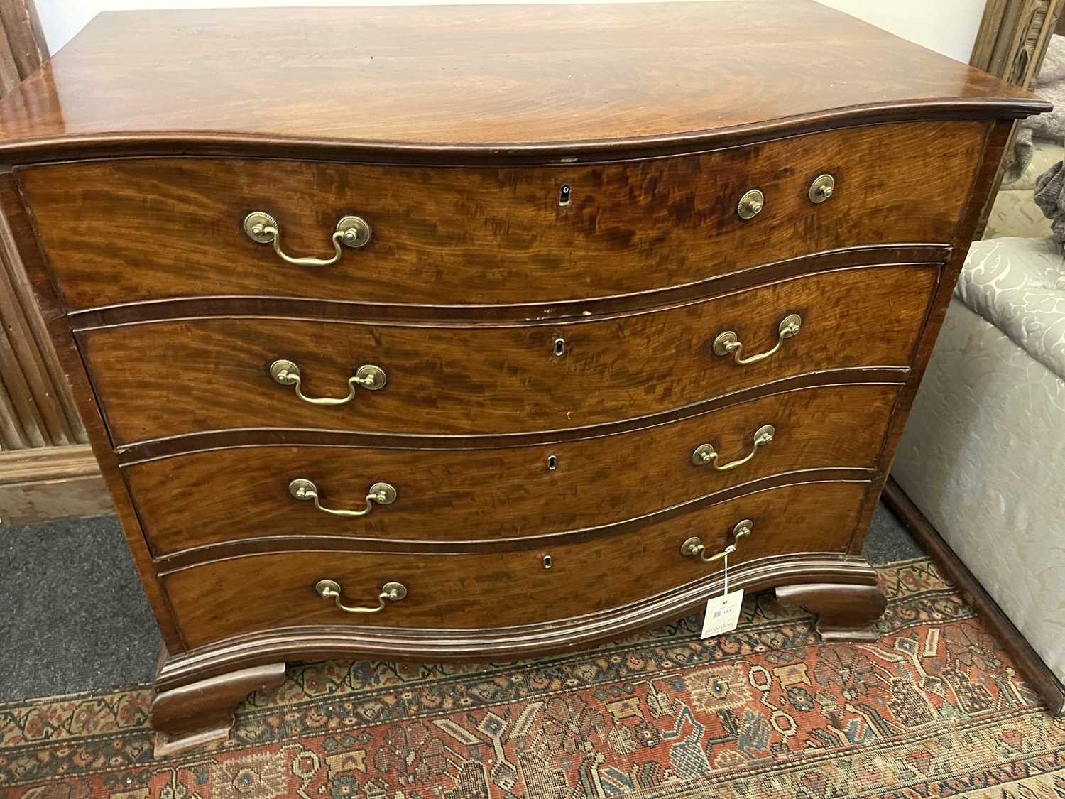 A George III mahogany serpentine commode, - Image 23 of 39