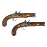 A pair of late flintlock travelling pistols,