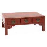 A Chinese low red-lacquered coffee table,