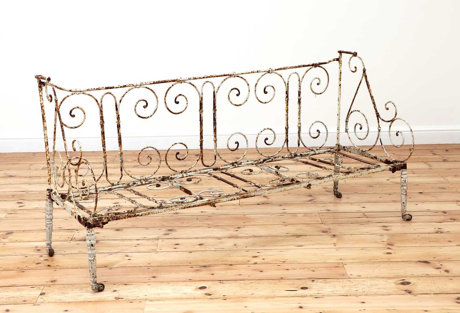 A French painted wrought iron settee,