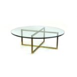 A glass and brass coffee table,